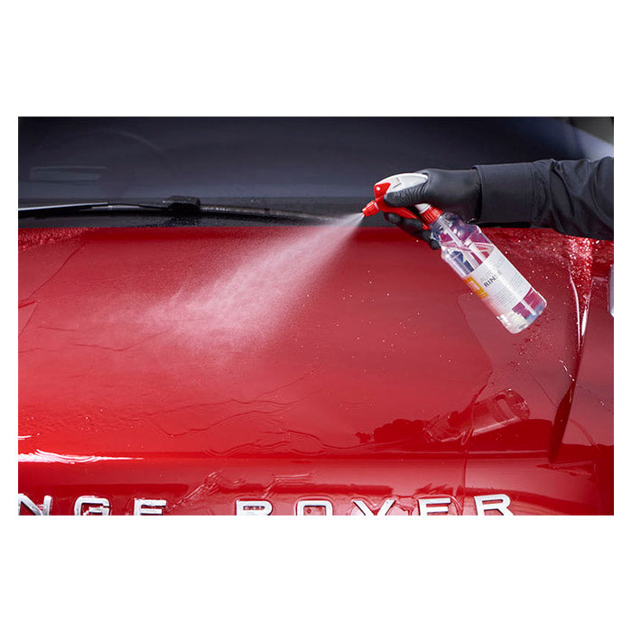 Spraying Autoglym Autogloss Rinse on a red car for shine